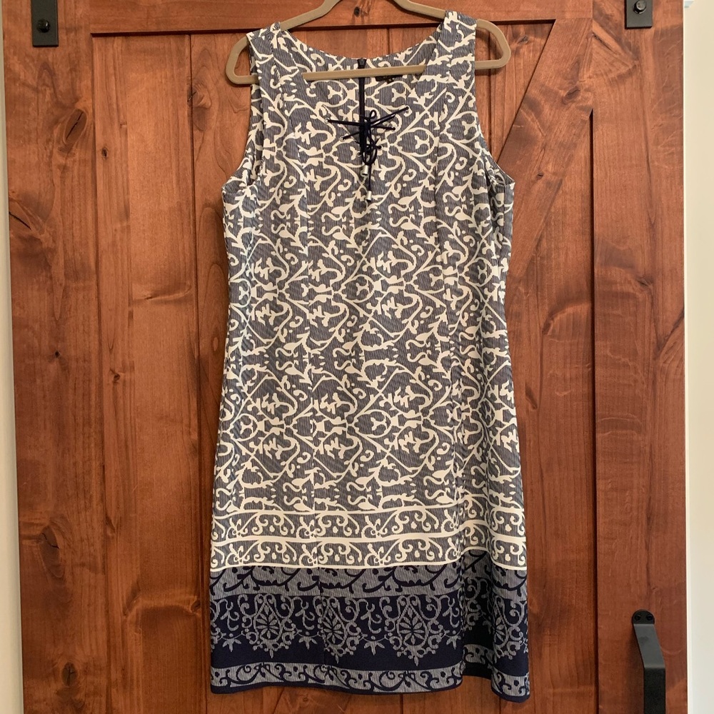 Figure flattering sleeveless dress.
